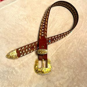 Gold tone bling belt quality leather, very little wear.  Fits 26 waist